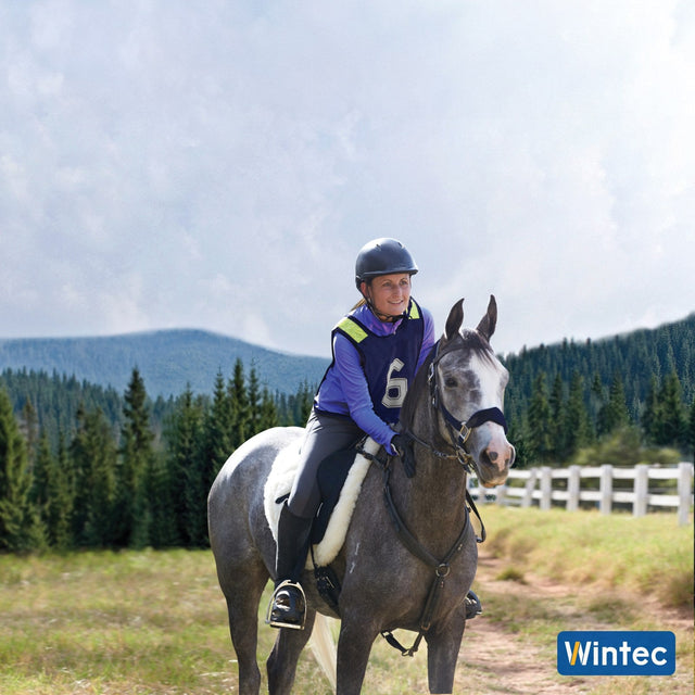 Endurance rider on a grey horse in a Wintec Pro Endurance saddle